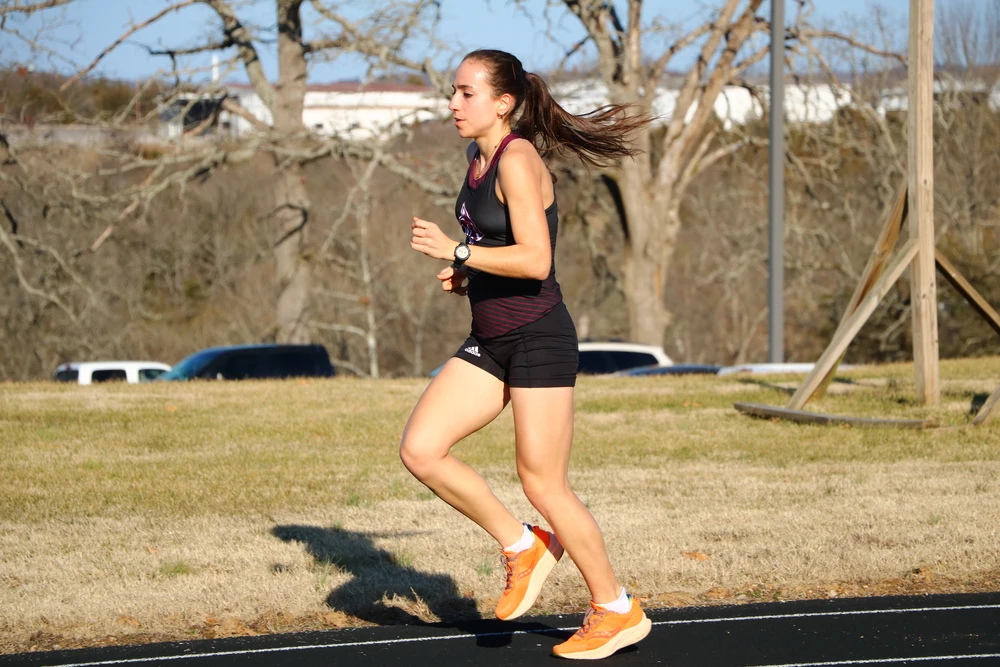 A College of the Ozarks Athlete performing a pole vault
